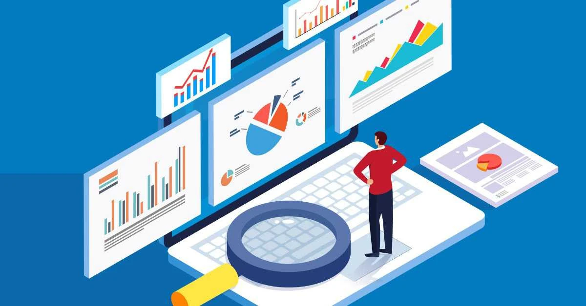 Analyst standing on a laptop surrounded by charts and reports